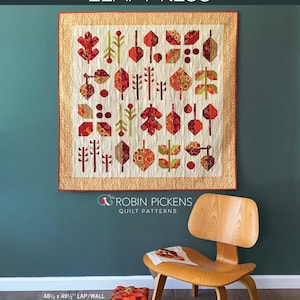 May include: A quilt pattern featuring a colorful leaf design with the title "LEAF PRESS" and the text "ROBIN PICKENS QUILT PATTERNS". The quilt is 48 1/2 inches by 49 1/2 inches and is described as a "lap/wall leaf sampler quilt" that is "fat eighth-friendly".