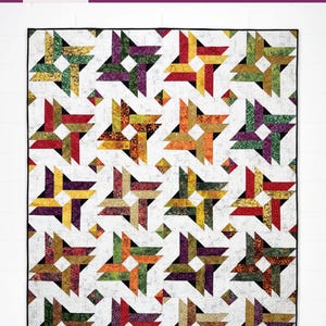 May include: A quilt pattern titled Double Whirl by Hunter's Design Studio, featuring a 2 1/2 inch strip-friendly design in three sizes. The quilt displays a repeating pattern of colorful pinwheel blocks in red, orange, yellow, green, and purple on a white background with small black accents.