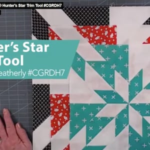 May include: A partially completed quilt block featuring a Hunter's Star design. The block incorporates white, teal, red, and black patterned fabrics. The text "Hunter's Star Trim Tool" is visible, along with the designer's name.