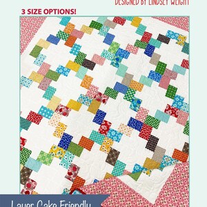 May include: A colorful quilt with a lattice design, featuring squares of various colors like red, blue, green, and orange on a white background. The text "Layer cake Lattice" and "Designed by Lindsey Weight" are visible. The quilt is "Layer Cake Friendly" and from "Primrose Cottage Quilts".