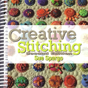 May include: A book titled "Creative Stitching, Second Edition" by Sue Spargo. The cover features a colorful array of stitched felt circles with various designs and colors.