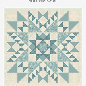 May include: A quilt pattern called "True North" with a blue and white geometric design. The quilt is 64 1/2 inches by 64 1/2 inches.