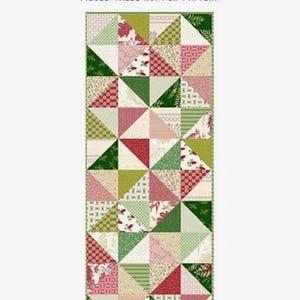 May include: A quilting pattern for a table runner titled "First Christmas". The pattern features a patchwork design with red, green, and white fabric. The table runner measures 16 1/2 inches by 40 inches.
