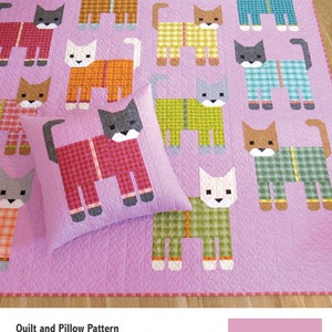 May include: A quilt and pillow pattern featuring a pink background with a design of cats wearing pajamas. The text "Cats in Pajamas" is at the top of the quilt. The text "Quilt and Pillow Pattern" is at the bottom left of the quilt. The text "A Pattern by Elizabeth Hartman" is at the bottom right of the quilt.