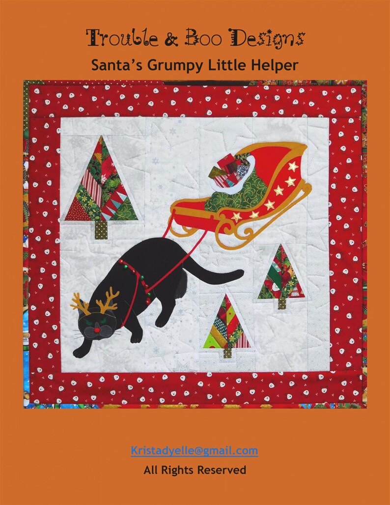 May include: A black cat with reindeer antlers pulls a red and gold sleigh filled with presents. The cat is in front of a white background with three Christmas trees. The text "Trouble & Boo Designs" and "Santa's Grumpy Little Helper" is at the top of the image. The text "Kristadyelle@gmail.com" and "All Rights Reserved" is at the bottom of the image.
