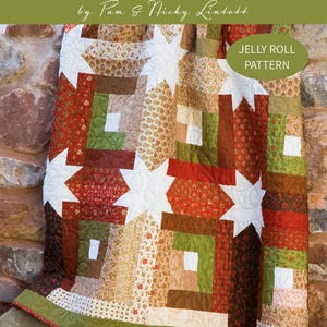 May include: A colorful quilt with a Log Cabin Hidden Stars pattern. The quilt features a patchwork design with star shapes and log cabin blocks in shades of red, green, brown, and cream. The text "LOG CABIN HIDDEN STARS" is visible.