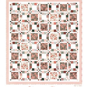 May include: A floral quilt with a patchwork design. The quilt features squares of floral patterns, checks, and solid colors in shades of pink, red, green, and white. The quilt measures 93" x 105". The text "Prairie Picnic" and "A Walk on the Prairie" are also visible.