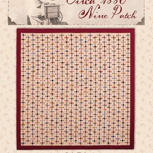 May include: A quilt featuring a repeating nine-patch pattern with small multi-colored squares on a light tan background, bordered by a dark red frame. The text Circa 1880 Nine Patch is at the top, with dimensions 71 1/8 inches by 77 1/2 inches below.