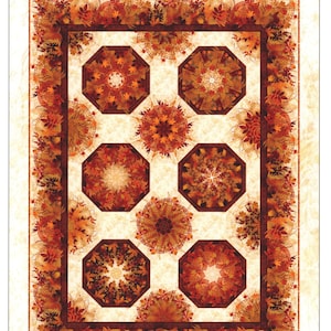 May include: A quilt titled "Reflections of Autumn II Kaleidoscope Quilt" featuring a cream background with a repeating pattern of octagons and circular designs. The quilt's border and central designs showcase autumn leaves in shades of orange, brown, and gold.