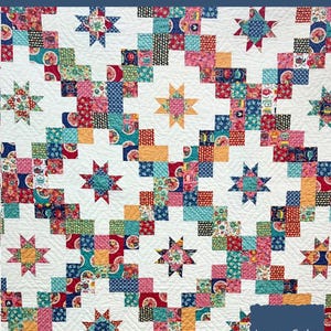 May include: A colorful quilt pattern with a ladder design and star accents. The quilt features squares of various patterned fabrics in red, blue, orange, and green, set against a white background. Finished quilt size is 50" x 70".