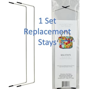 May include: A set of two silver bag stays with black plastic tips. The stays are 24 inches long and 4 inches wide. The packaging includes the text "1 Set Replacement Stays" and "Aunties Two Patterns".