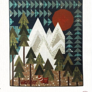 May include: A handmade quilt with a mountain and forest design. The quilt features a red sun, white mountains, and green trees. The text "The Mountains are Calling" is at the top. Finished size is 51" x 60".