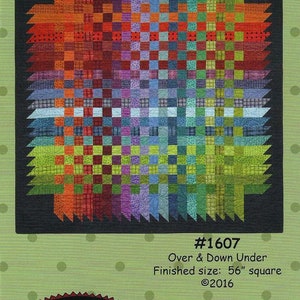 May include: A colorful quilt pattern titled "Over & Down Under" with a finished size of 56 inches square. The design features a vibrant array of colors arranged in a geometric pattern. The text "All Through the Night" is also visible.