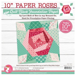 May include: A square quilt block foundation paper with a large rose design. The paper is labeled "10" PAPER ROSES" and includes text about foundation paper piecing. The rose is made of various pink and red fabrics, surrounded by green and white patterned fabrics. The paper makes 10" blocks.