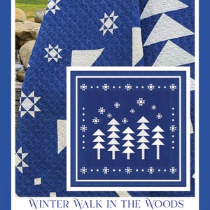 May include: A blue and white quilt pattern with a winter scene of trees and stars. The quilt is titled "Winter Walk in the Woods" and is by Fig Tree & Co.