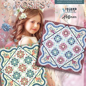 May include: A quilt pattern called "Pocket Full of Posies" featuring a floral design with a white background and blue, red, and green accents. The pattern is from the Island Batik Joyful Collection and is a Worx Session Pattern by Judy Niemeyer.