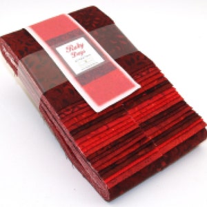 May include: A stack of red fabric strips with a label that reads "Ruby Tape" in a white font.