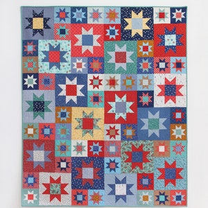 May include: A colorful quilt pattern called "Twinkle" featuring a patchwork of red, blue, yellow, and white stars. The quilt is made with fat quarters and is available in five sizes. The text "Cluck Cluck Sew" is in the lower left corner of the image.