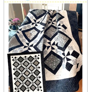 May include: A black and white quilt with a geometric pattern. The quilt is called "Hidden Star" and is available in throw, twin, queen, and king sizes.