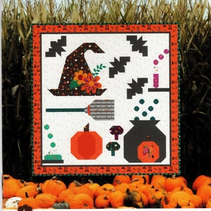 May include: A quilt pattern titled "A Little Witchy Sampler" by Sew A Story. The pattern features a witch's hat, broom, cauldron, and pumpkins. The finished quilt size is 41 inches by 42 inches.