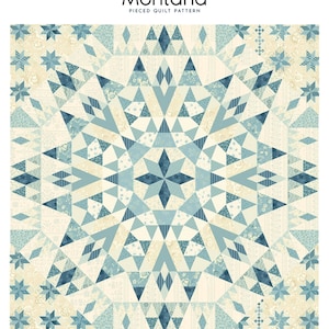 May include: A quilt pattern called "Montana" with a pieced design featuring a starburst pattern in shades of blue and cream. The quilt is 60 inches by 60 inches.