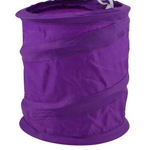 May include: A purple collapsible laundry hamper with a white drawstring. The hamper is made of a soft, fabric material and has a cylindrical shape.