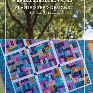 May include: A colorful quilt with the text "PATCHES OF BRILLIANCE" and "PLANTED SEED DESIGNS". The quilt features a teal border with floral patterns and a central design of rectangular patches in various colors, including purple, yellow, and teal.