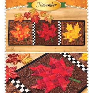 May include: Patchwork accent runner featuring three quilted maple leaf designs in shades of red, orange, and yellow. The runner has a black border and a brown background. The text "Leaves November" is displayed at the top.