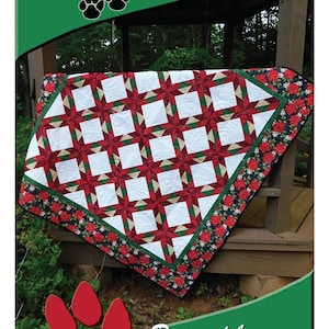 May include: A quilt featuring a Hunter's Star Chain pattern with white squares, red star points, and green accents. The border displays a floral print on a black background. Text includes DEB'S CATS N QUILTS Presents: Hunter's Star Chain and Two Sizes.