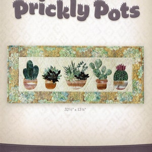 May include: A quilting pattern called "Prickly Pots" featuring five cactus plants in pots. The pattern is 32 1/2 inches by 13 1/4 inches. The pattern is designed by McKenna Ryan.