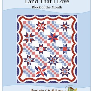 May include: A quilt block design titled "Land That I Love" with a star pattern in red, white, and blue. The design is framed with a red and blue border and includes the text "Block of the Month" and "Prairie Quilting".