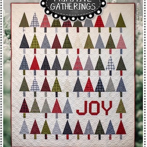 May include: A quilted Christmas tree pattern with the word "JOY" in red. The quilt features rows of trees in various colors and patterns, including red, green, and gray. The text "TREE LOT" is at the bottom. Finished size is 69" x 81".
