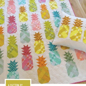 May include: A quilting pattern for a pineapple quilt and pillow. The pattern includes instructions for three quilt sizes and a 20" x 20" quilted pillow cover. The pattern is by Elizabeth Hartman.