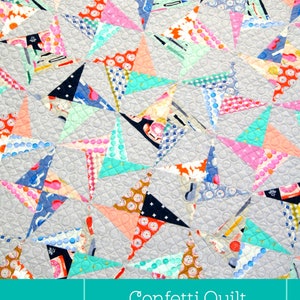 May include: A colorful confetti quilt pattern with a gray background. The quilt is made with a variety of fabrics in pink, blue, green, and orange. The text "Confetti Quilt" is written in white on a turquoise background.