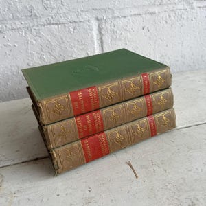 VINTAGE BOOK STACK | vintage green with red & gold accents, Robert Louis Stevenson, table styling, old books, coffee table books