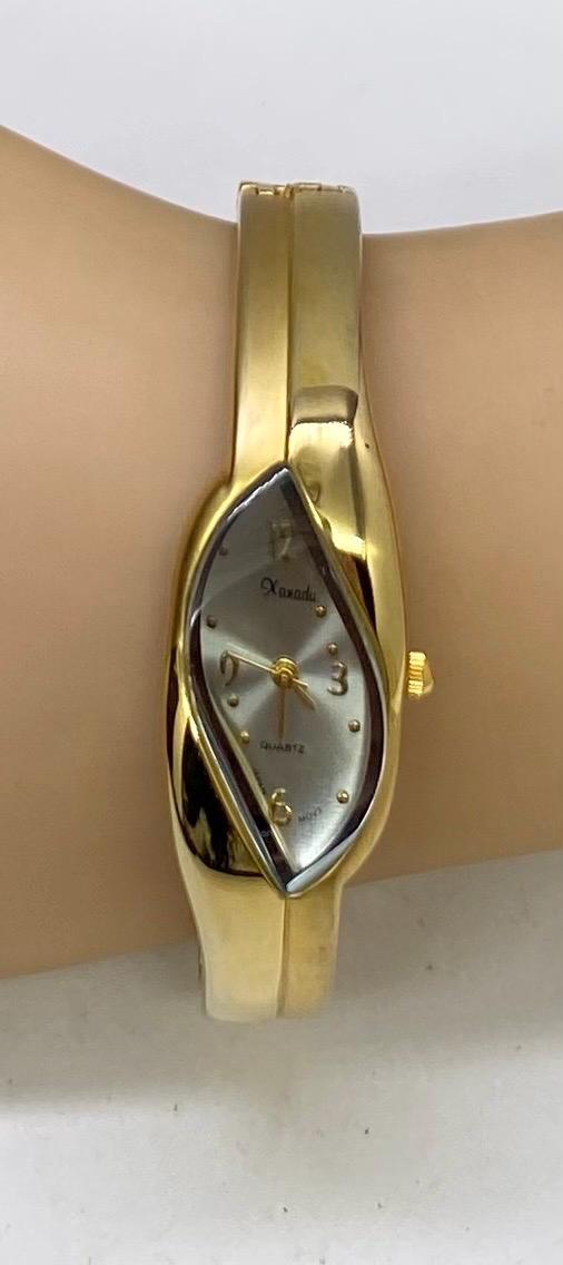Vintage Xanadu Gold Tone Hinged Cuff Watch Women display picture 2