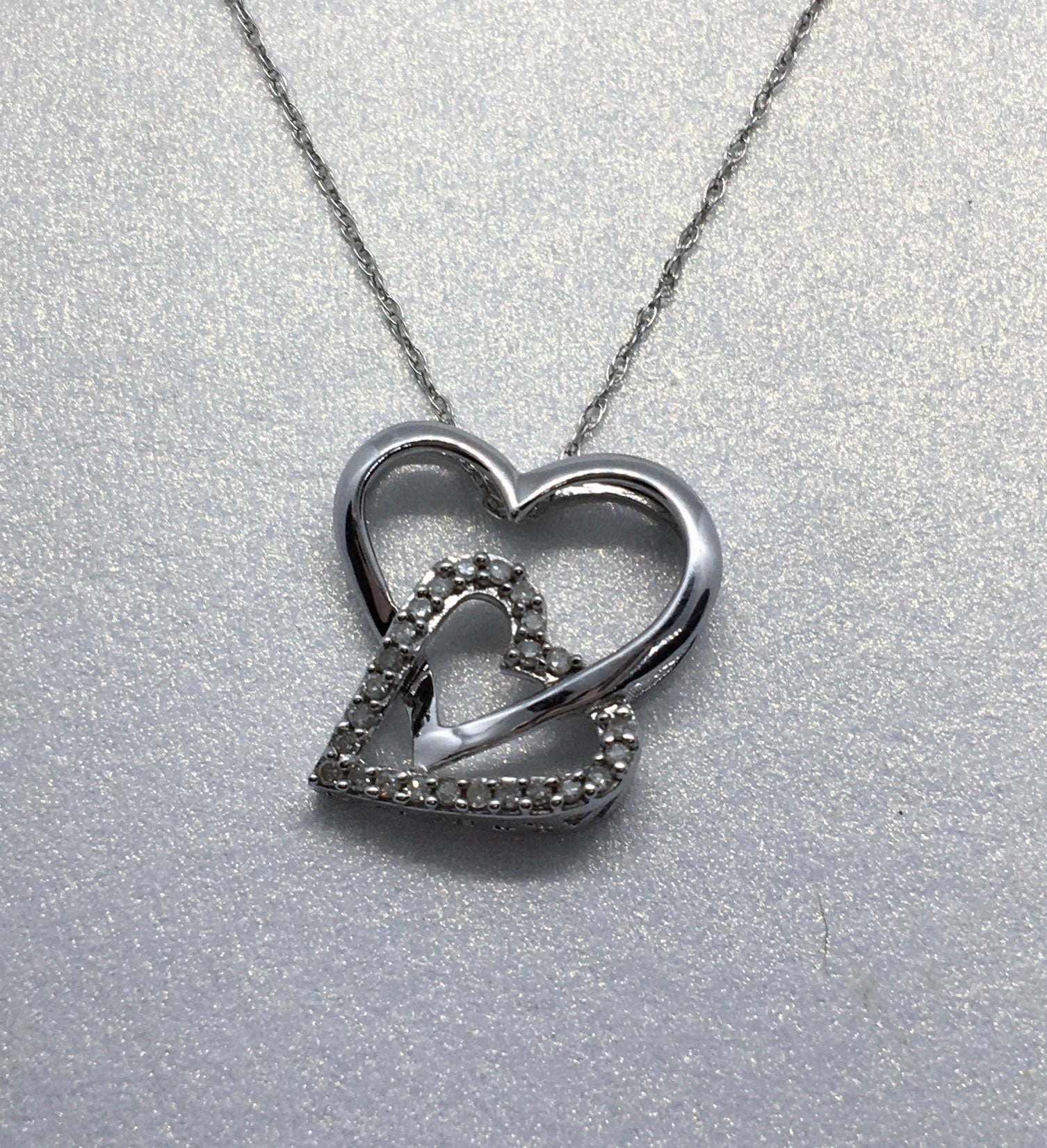 Two hearts. One love. | Heart jewelry, Jewelry set design, Diamond pendants  designs