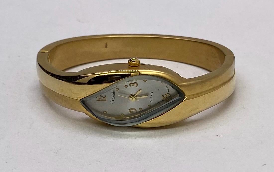 Vintage Xanadu Gold Tone Hinged Cuff Watch Women's Modernist