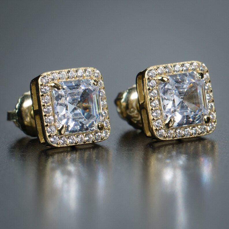 Gold emerald cut stud earrings