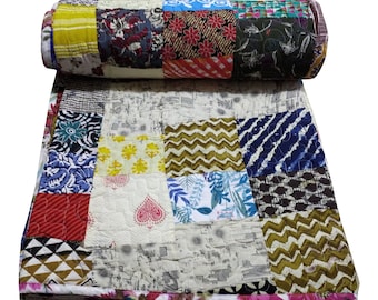 May include: A colorful patchwork quilt with a variety of patterns and colors, including red, blue, green, yellow, and brown. The quilt is made of cotton fabric and is quilted with a simple stitch.