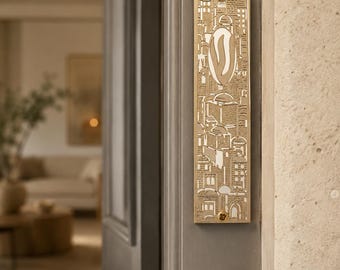 Elegant small mezuzah crafted from transparent plexiglass and refined metal, featuring an intricate Jerusalem skyline design in soft gold