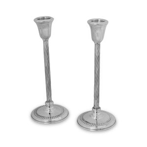 May include: A pair of silver candle holders with a twisted design and a beaded base.