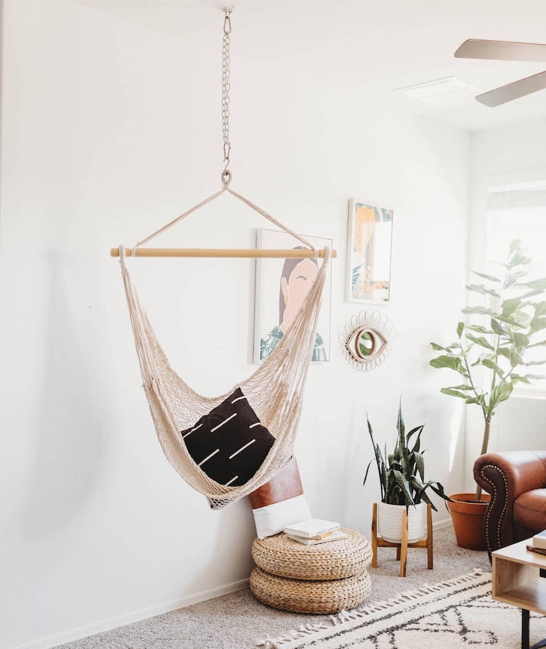 white woven cotton hammock chair indoors in a living room