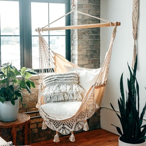 hammock chair indoors with brick wall