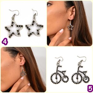 May include: Two pairs of earrings. The first pair features a silver star shape with black rhinestones. The second pair features a silver bicycle shape with black rhinestones.
