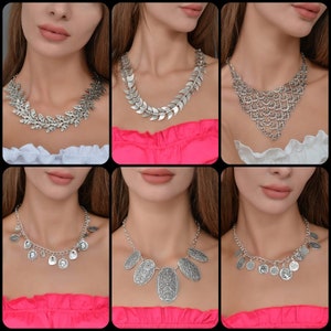 Puede incluir: Seis collares de plata diferentes en modelos con estilos variados, incluyendo diseños de hojas, cadenas y monedas.