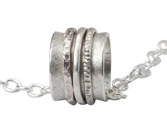 Matt 925 silver pendant with rotating rings