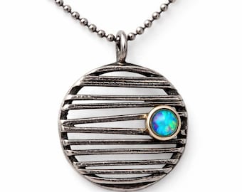 Round silver pendant with synthetic opal