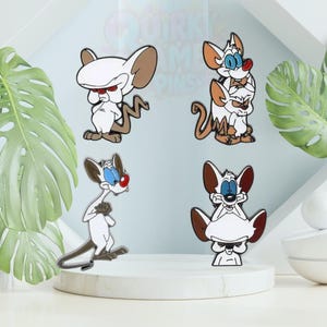Pines esmaltados de ratón de laboratorio de dibujos animados: insignias inspiradas en Pinky y Cerebro