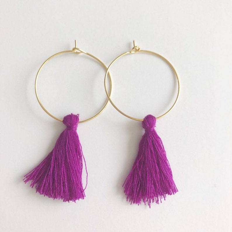 Gold and purple tassel statement hoop earrings